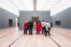 People viewing artwork at a museum in Basel